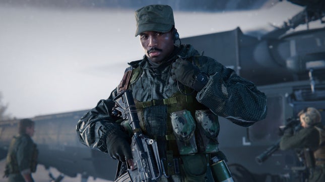 A soldier carrying a big gun in battle looks full of military aura.